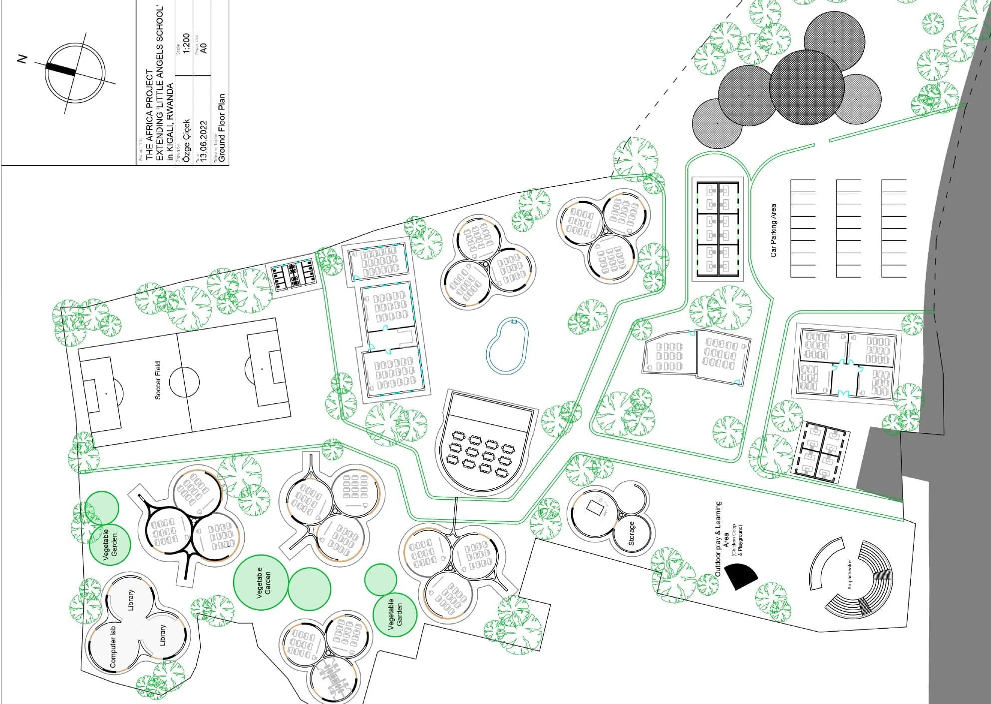 Ground plan for the proposed Little Angels School expansion, organizing circular classrooms, gardens, play areas, and community facilities along shaded paths