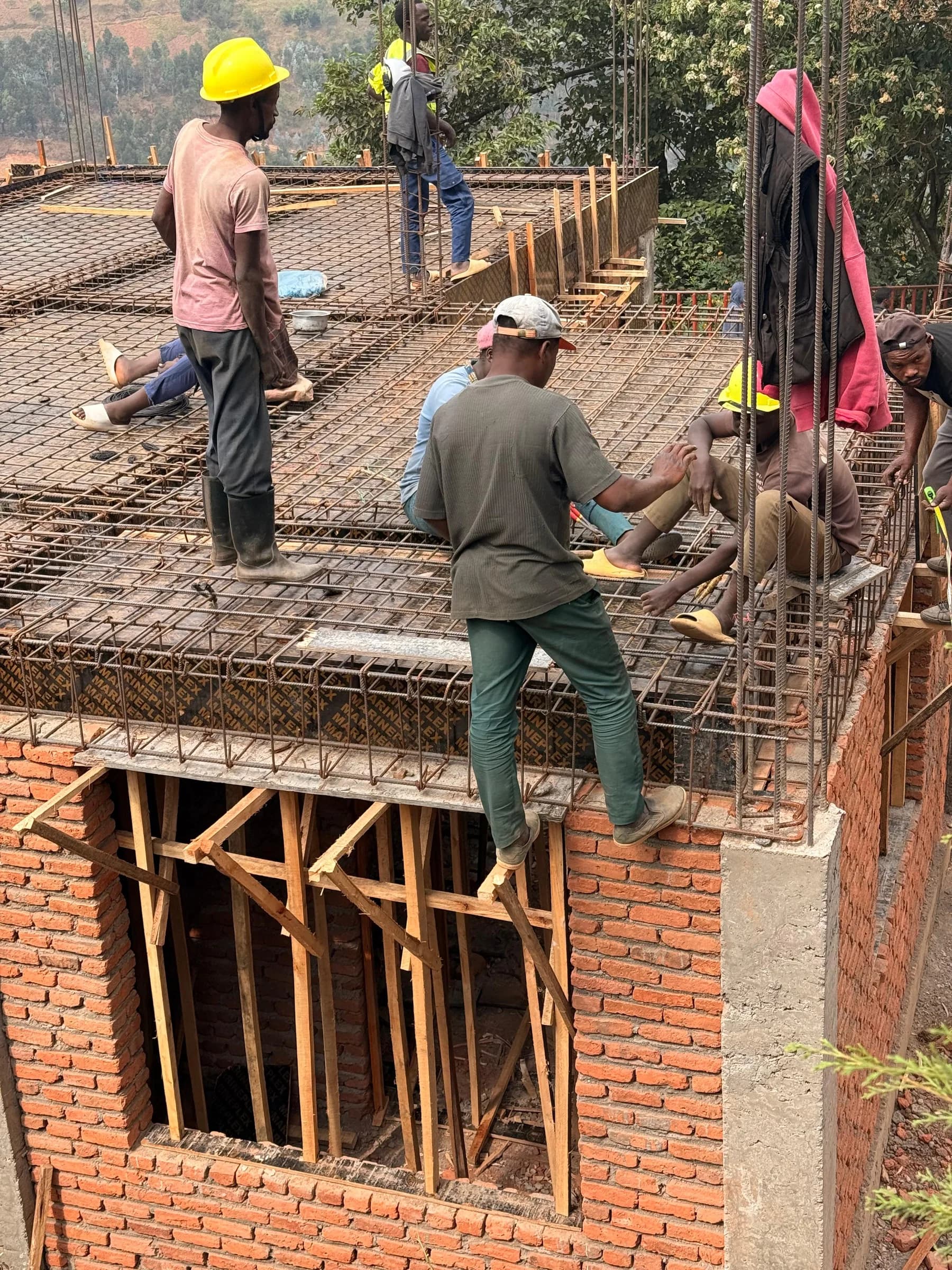 The Sunzu construction team coordinates reinforcing steel before the next concrete pour